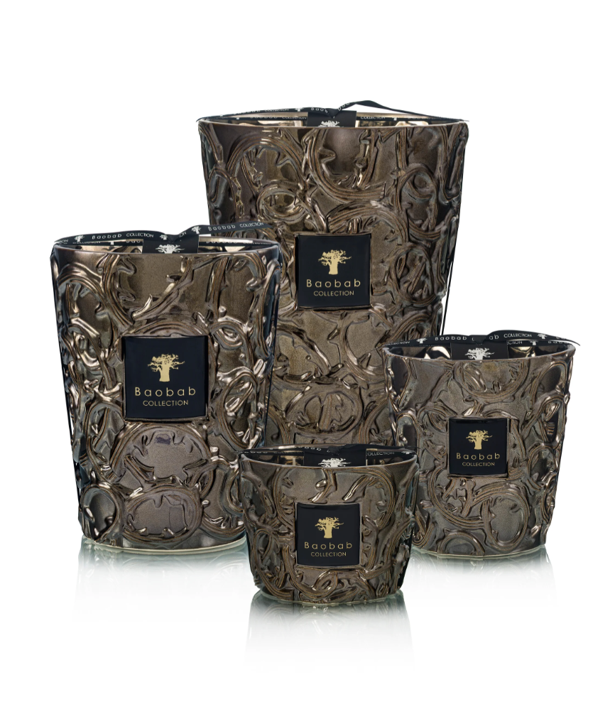 Set of decorative candles with intricate designs and 'Baobab' branding on a white background
