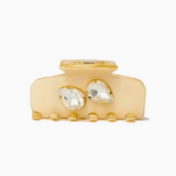 Cream-colored hair clip with crystal stones on a white background