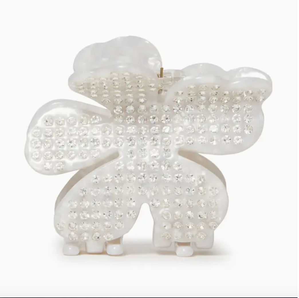 Large white flower shaped claw clip with silver crystals embedded in it