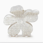 Large white flower shaped claw clip with silver crystals embedded in it