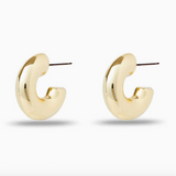 Chunky gold hoop earrings on a white background