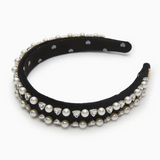 Black headband with pearls and crystals on a white background