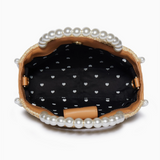 Clutch bag with pearl embellishments on a white background