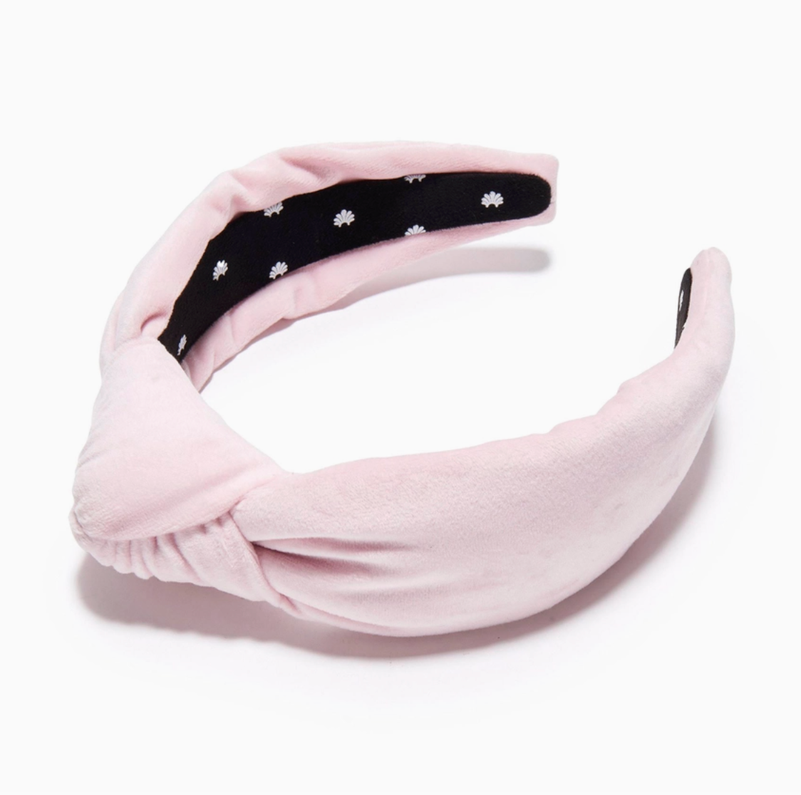 Pink headband with a black center underside section on a white background