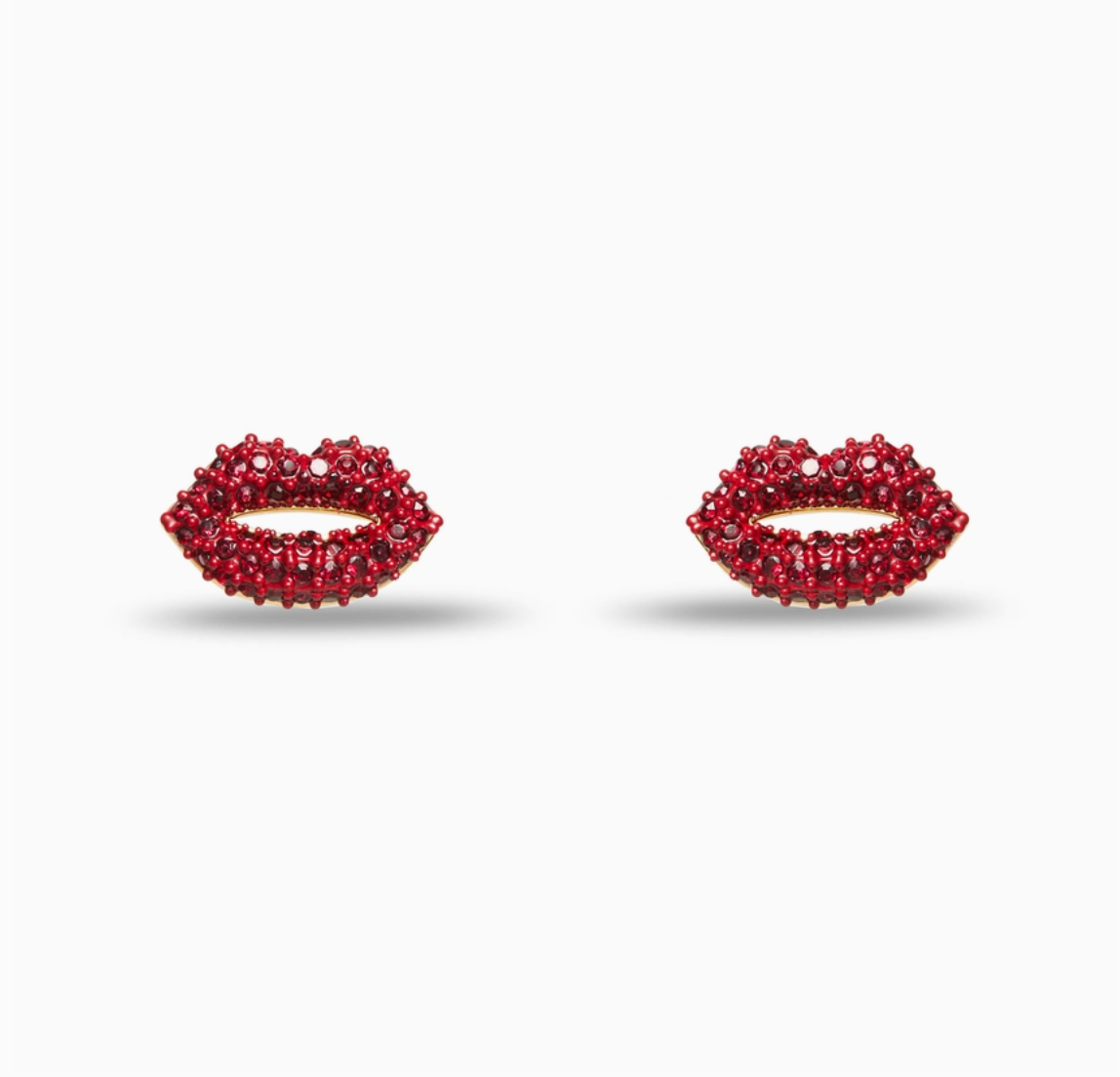 Red lip-shaped earrings on a white background