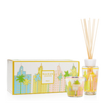 Scented candle and diffuser set with cityscape design packaging on a white background