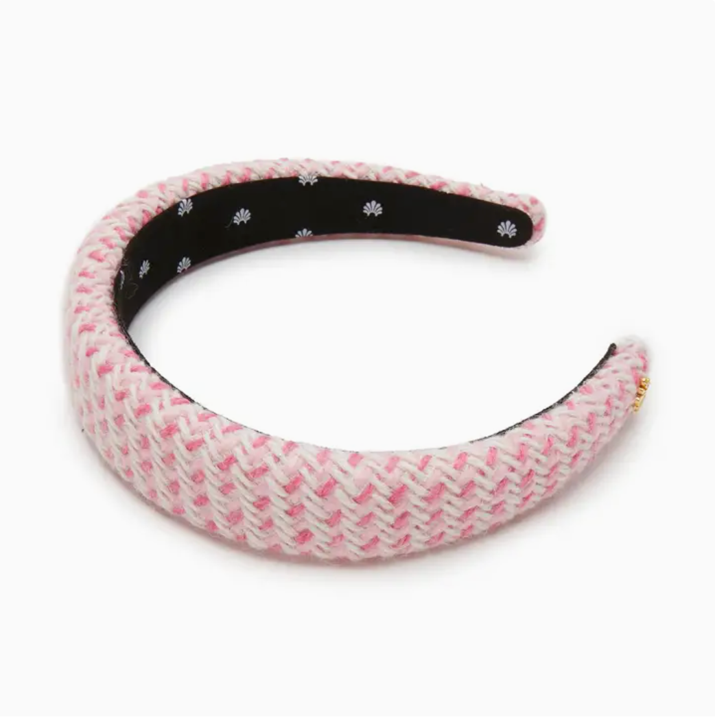 Pink textured headband with a black internal band on a white background