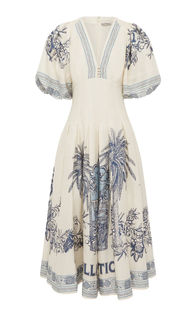White dress with blue palm tree pattern on a white background
