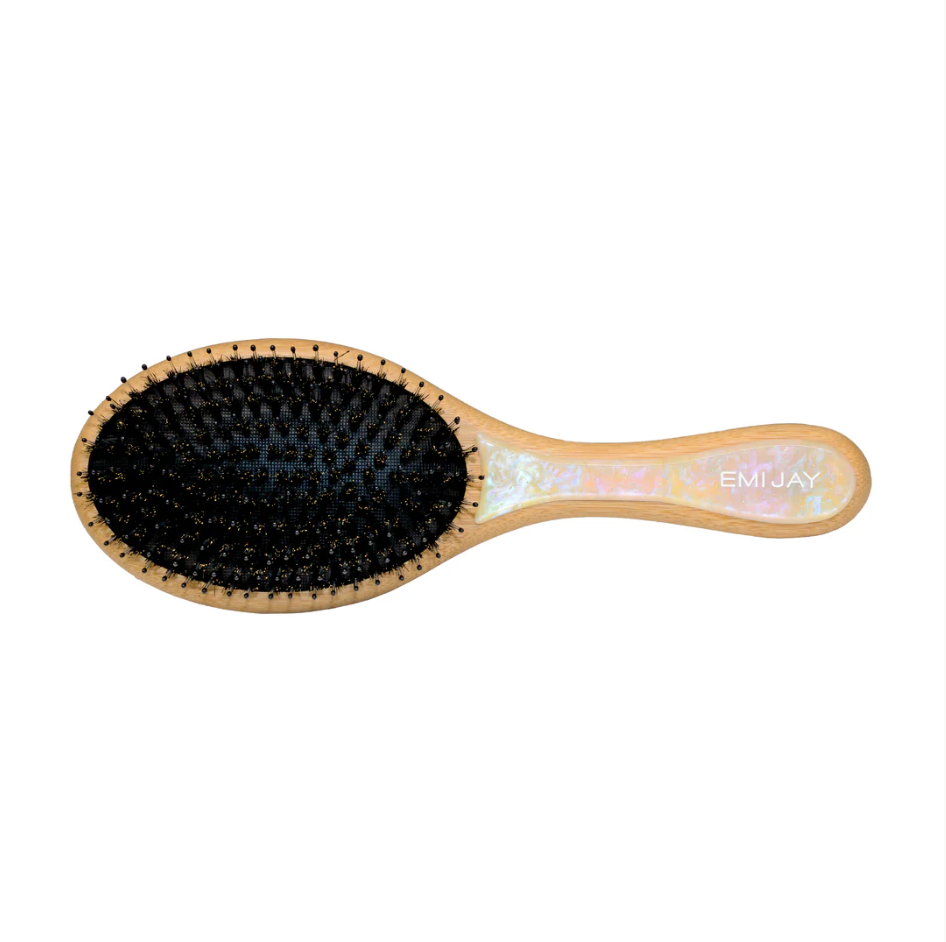 Hairbrush with black bristle head and iridescent handle on a white background