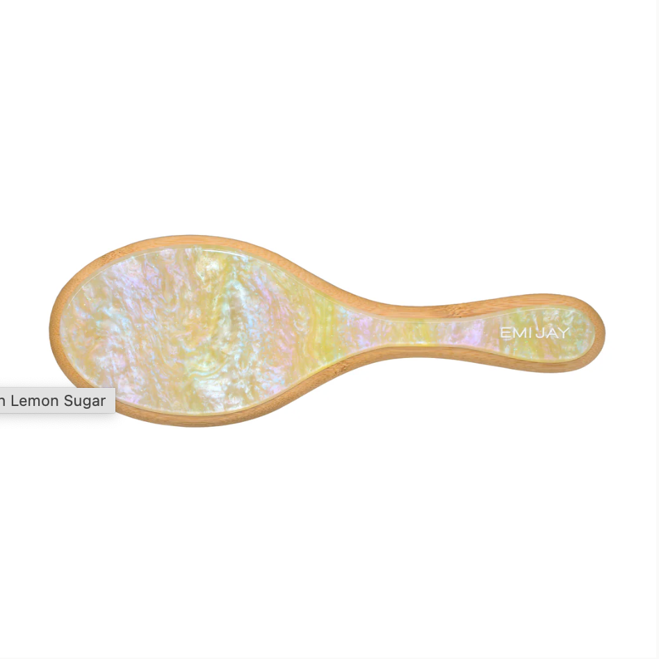 Hairbrush with a marbled design on a white background