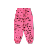 Pink sweatpants with black bandana pattern on a white background