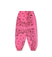 Pink sweatpants with black bandana pattern on a white background