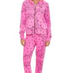 Pink sweat set with a pattern worn by a model on a white background