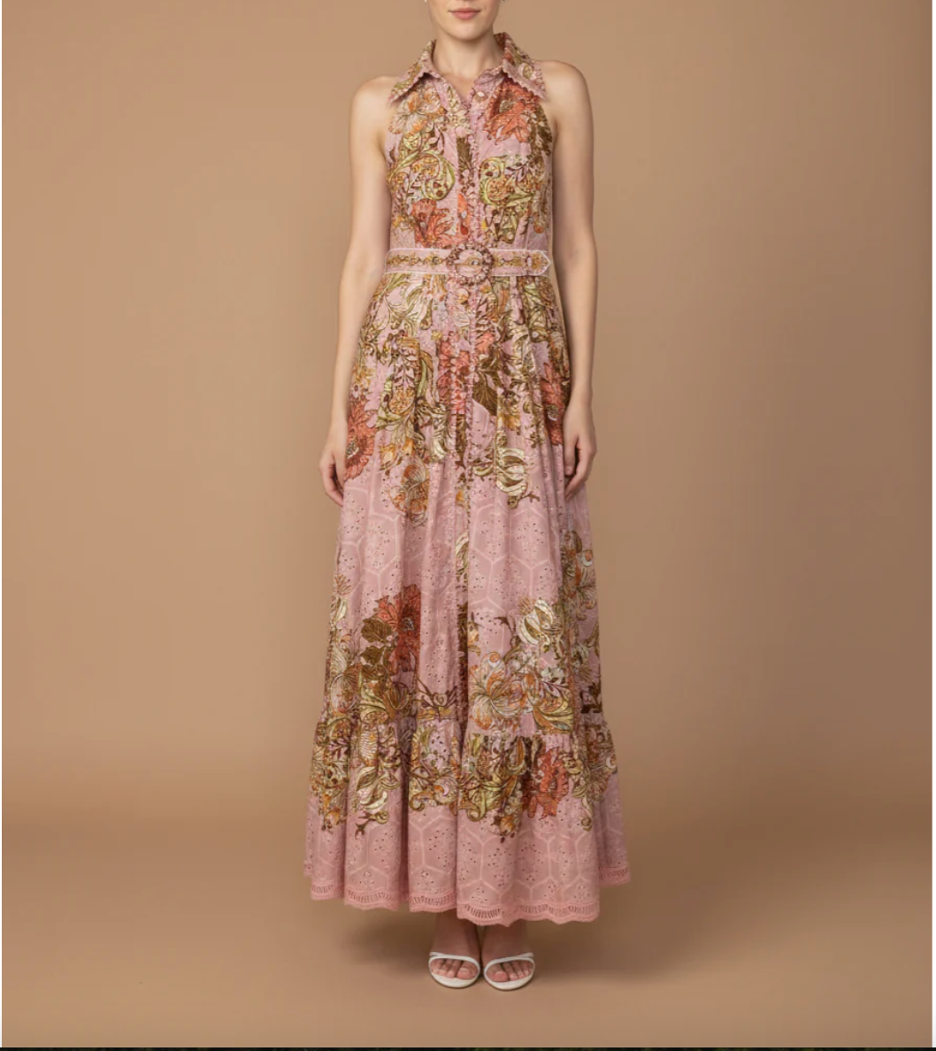 Floral dress on a model against a brown background