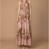 Floral dress on a model against a brown background