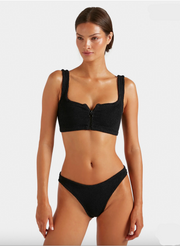Woman wearing a black bikini set on a white background