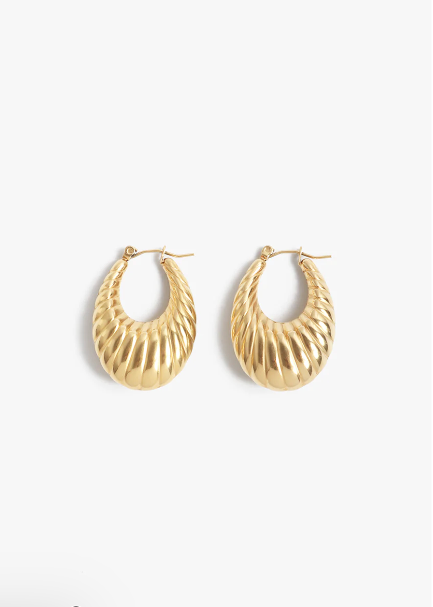 Gold hoop earrings on a white background