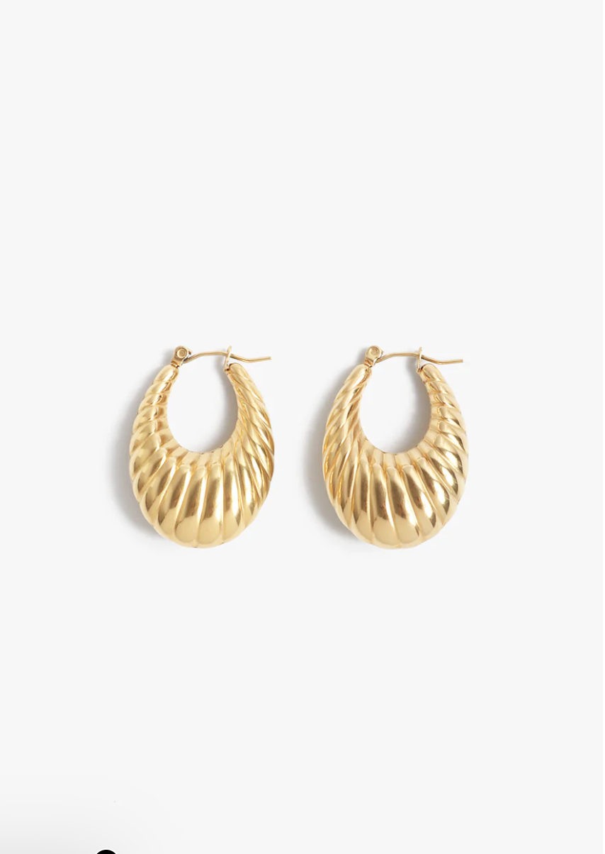 Gold hoop earrings on a white background