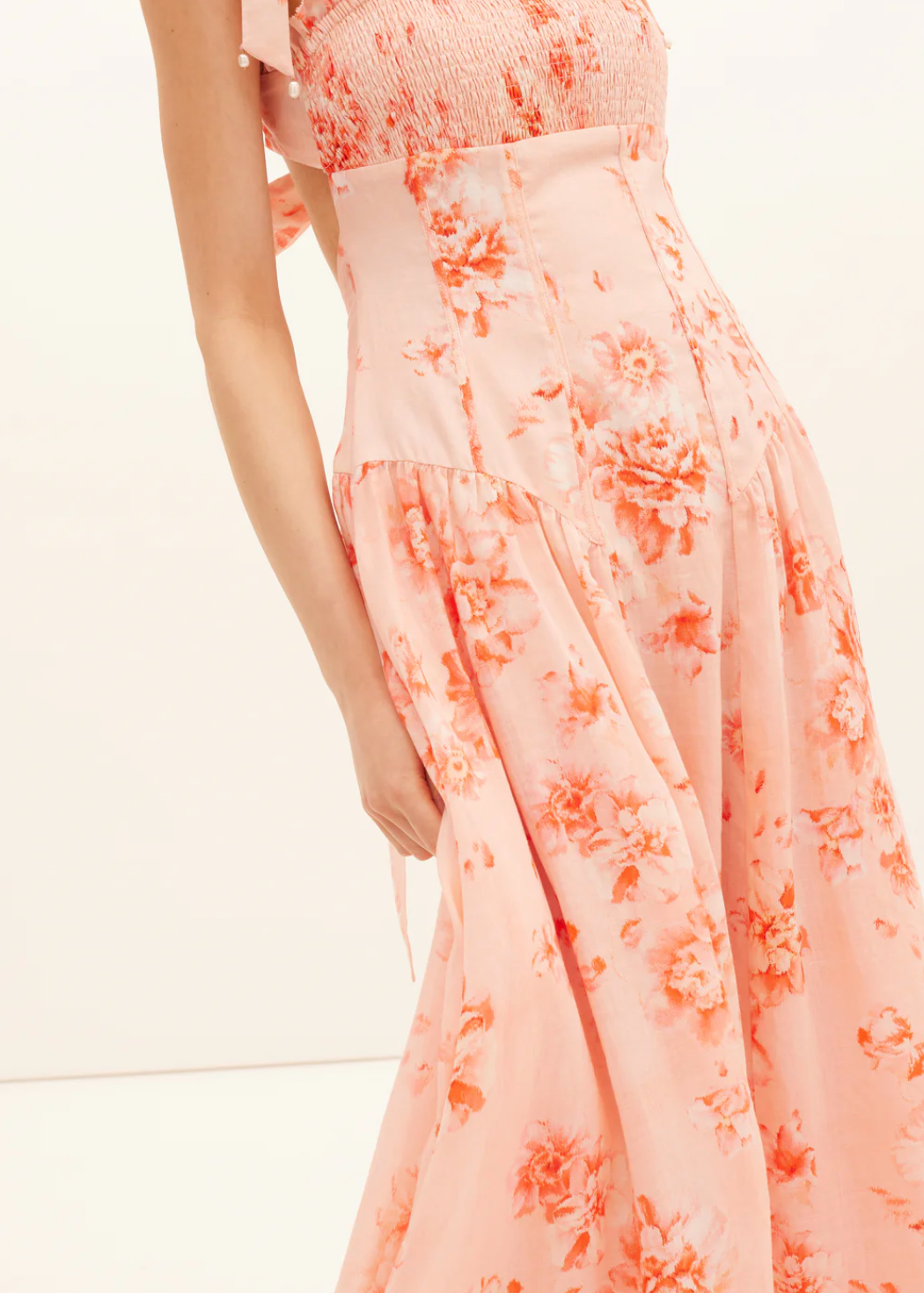 Peach floral dress on a white background