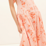 Peach floral dress on a white background