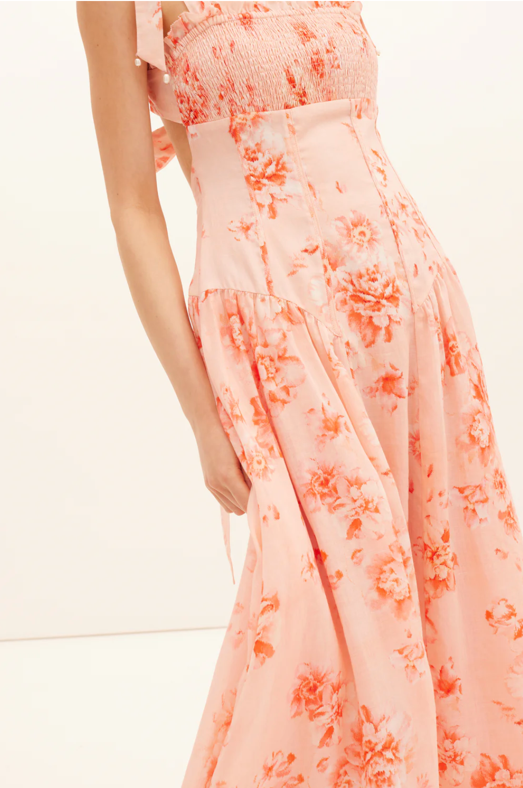 Peach floral dress on a white background