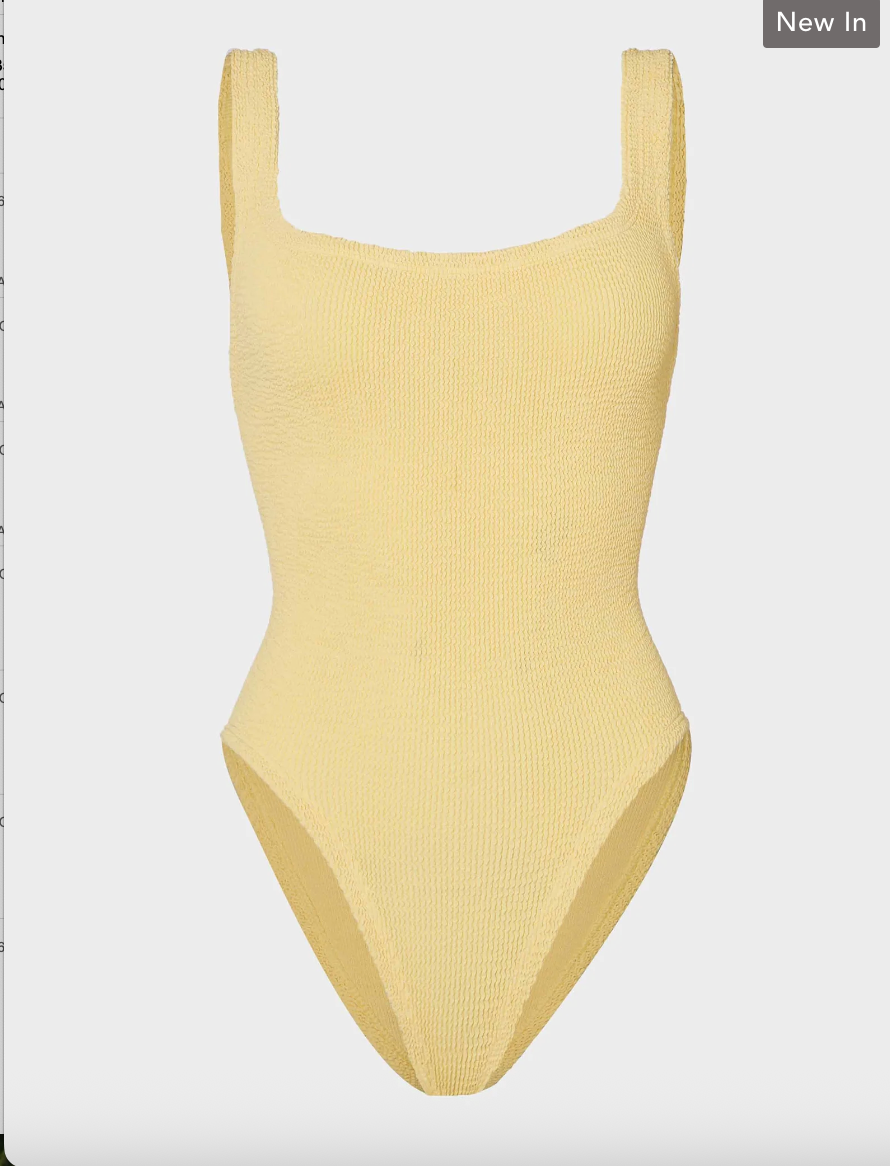 Yellow ribbed swimsuit on a light gray background