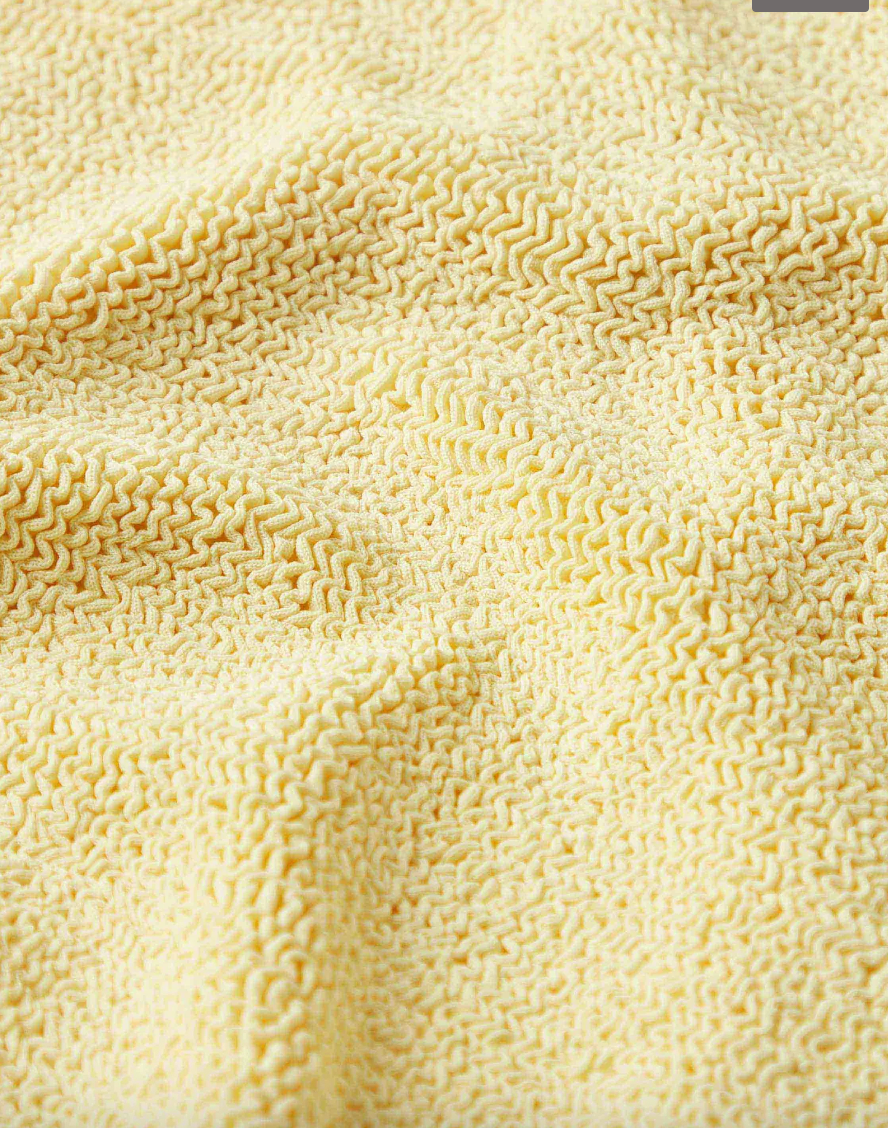 Close-up of a textured beige fabric surface