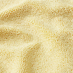 Close-up of a textured beige fabric surface