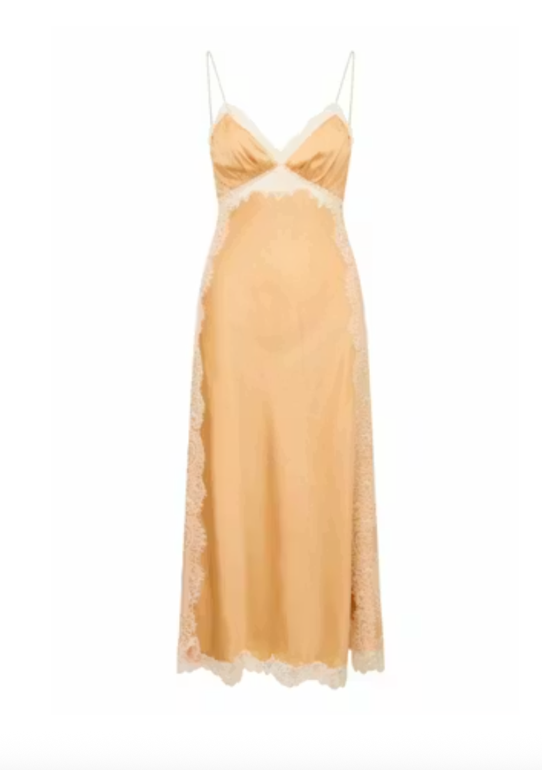 Yellow gold slip dress with lace trim on a white background