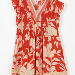 Red floral dress with white flowers on a white background