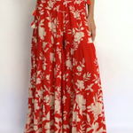 Red and white floral outfit on a plain background