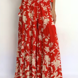Red and white floral outfit on a plain background