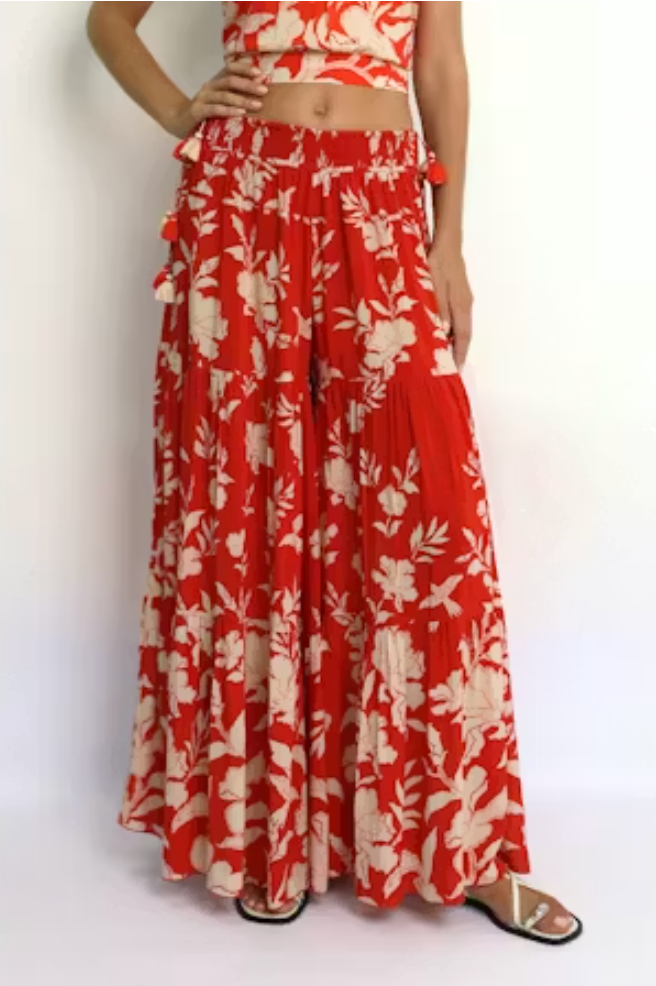 Red and white floral outfit on a plain background