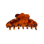 Tortoiseshell patterned hair clip on a white background