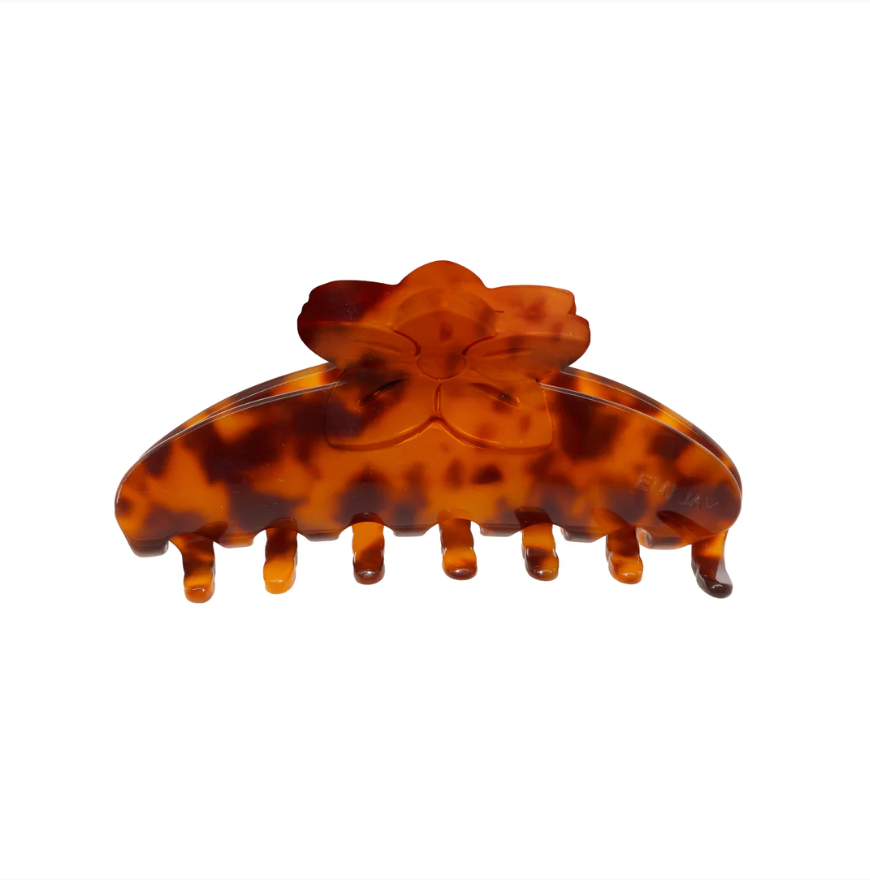 Tortoiseshell patterned hair clip on a white background