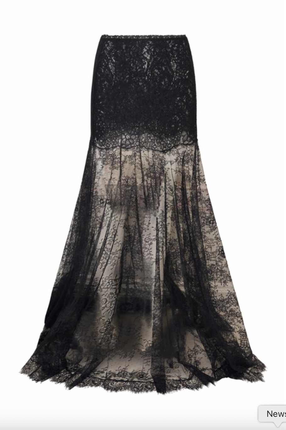 A black lace mermaid-style skirt with a fitted bodice and a sheer, flowing skirt that fades into a smoky sheer overlay, shown on a plain white background.