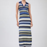 Woman wearing a long, multicolored striped dress on a white background