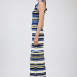 Woman wearing a striped dress on a white background
