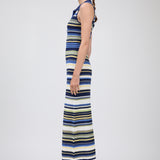 Woman wearing a striped dress on a white background