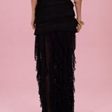 Black layered skirt on a pink background